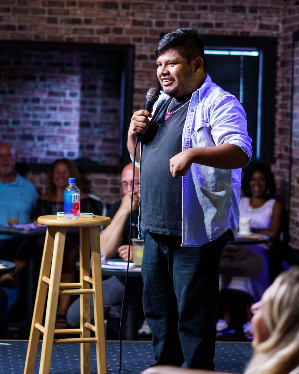 Ronnie Rohrbeck performing stand-up on stage